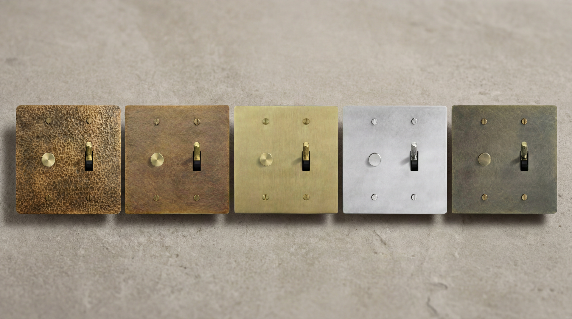 Five luxury 2 Gang Toggle Switches with authentic patina in brass, nickel, and matte black, showcasing fine craftsmanship.