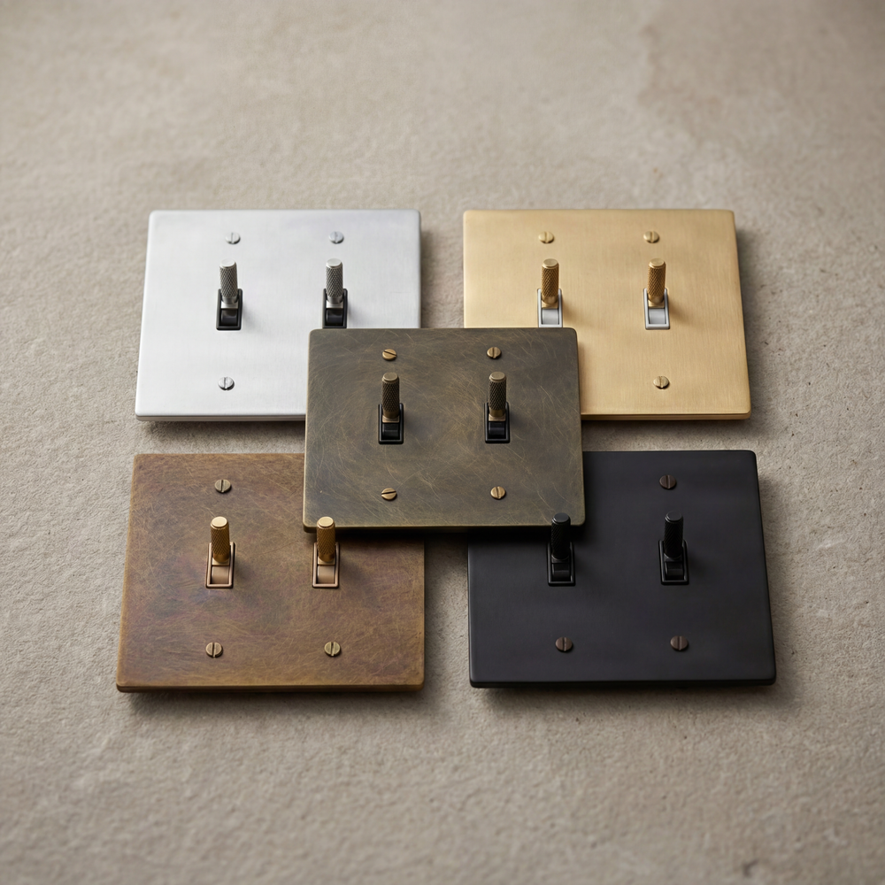 Timeless 2-gang toggle switches, diverse metal patinas.