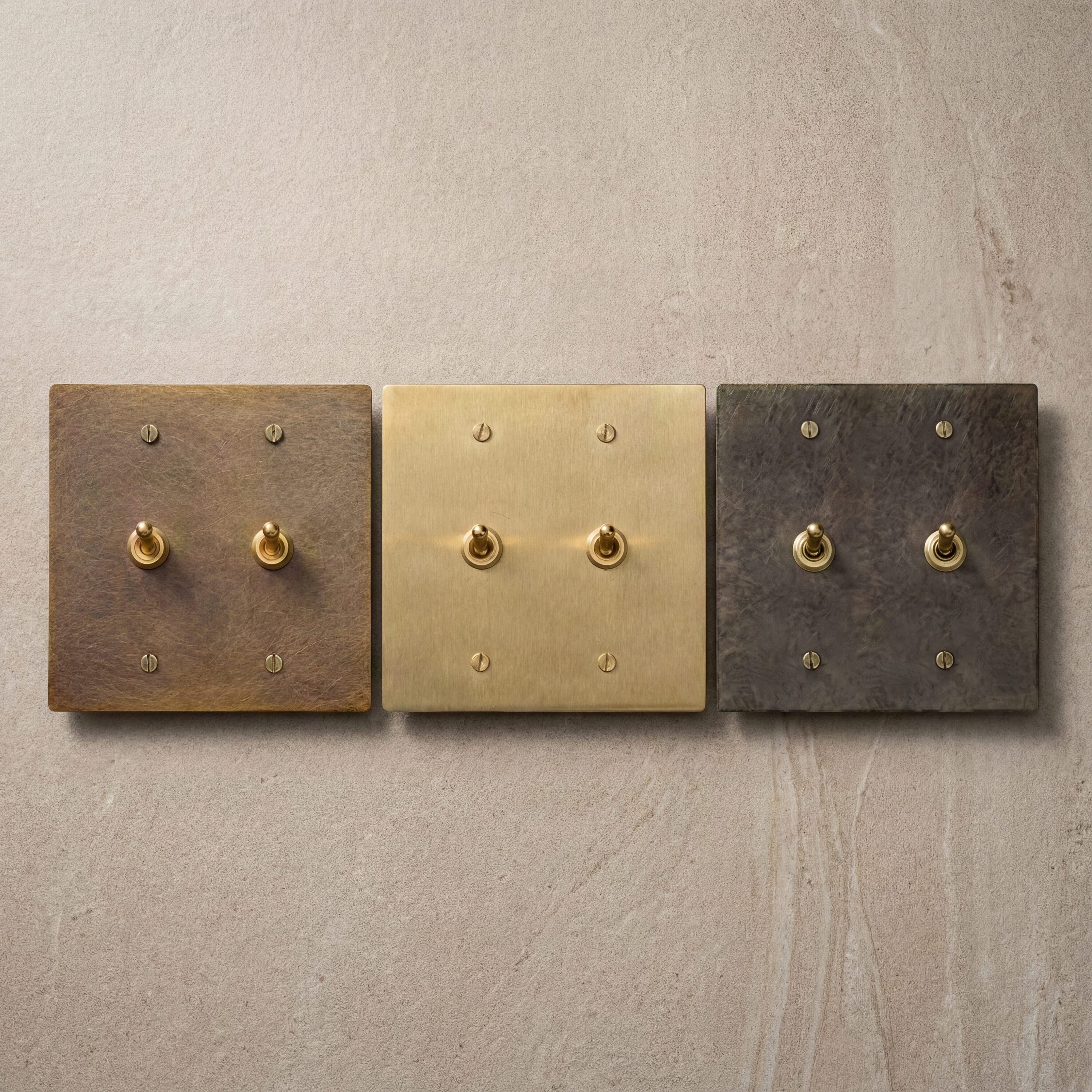 Three solid brass toggle switches with rich, unique patinas.
