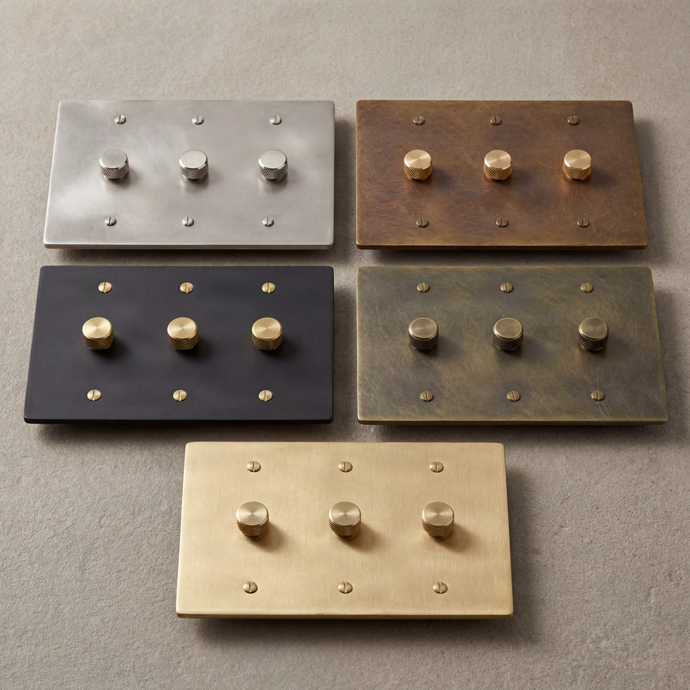 Crafted 3-gang dimmer switches showcasing diverse metal finishes.