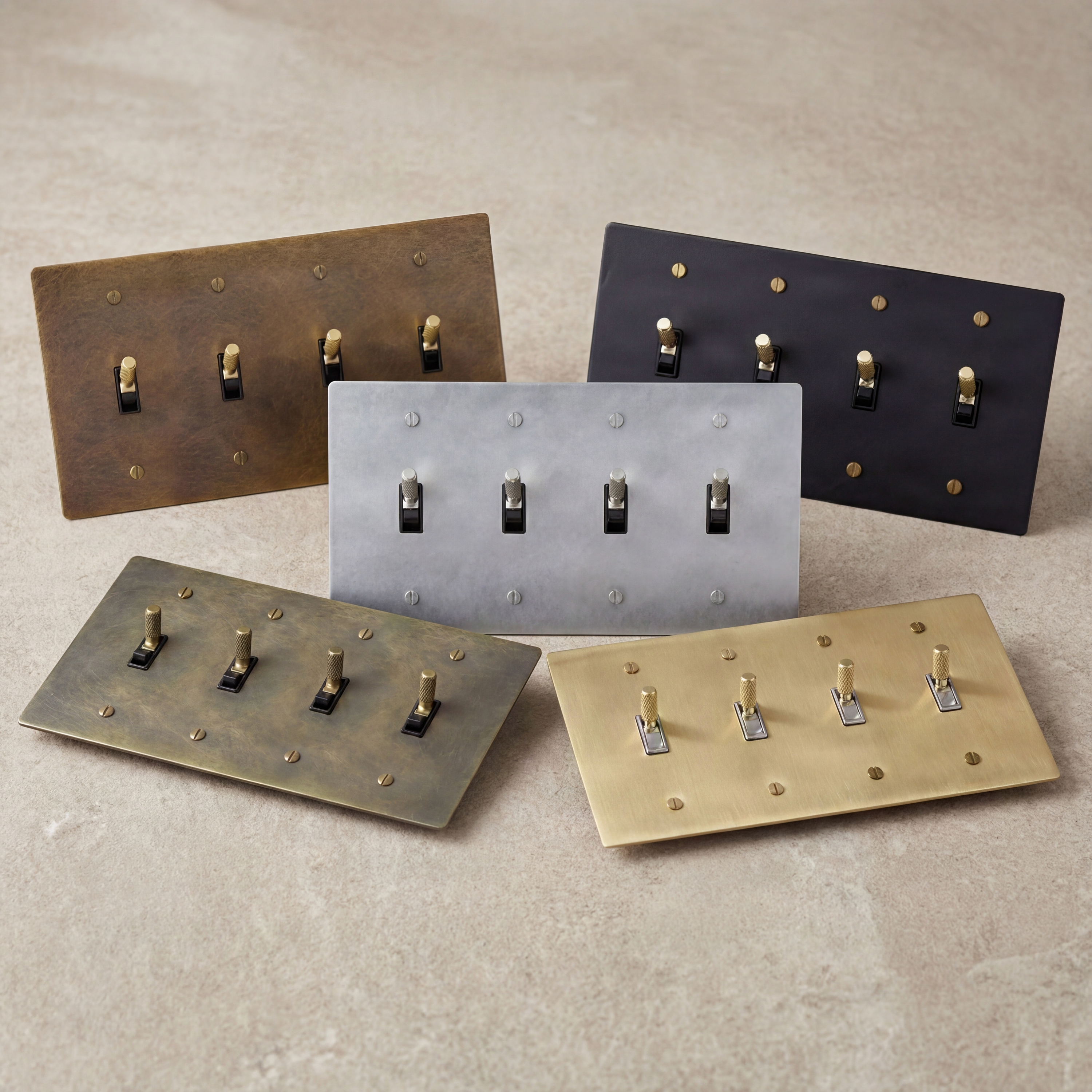 Five luxury 4-gang toggle switches in diverse metal finishes.