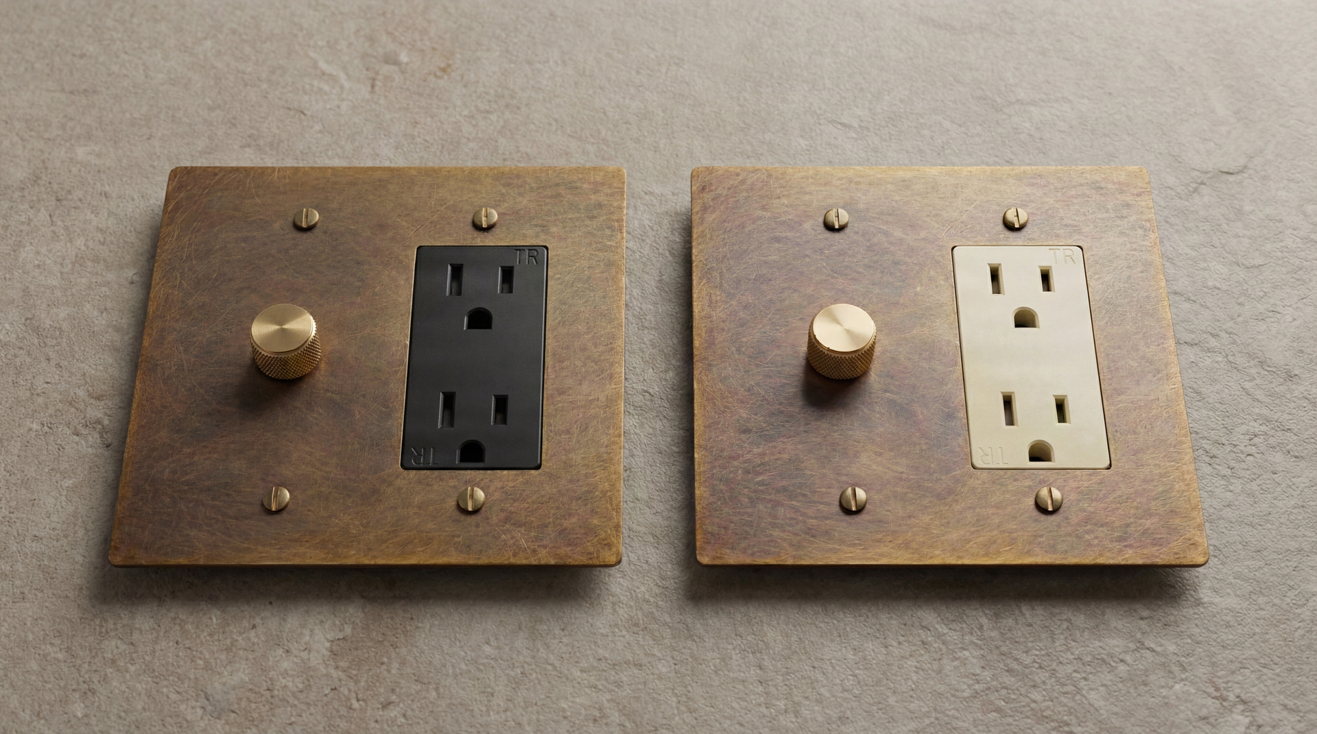 Muted Aged Brass Dimmer Outlets with knurled knobs, black and cream receptacles, conveying timeless craftsmanship.
