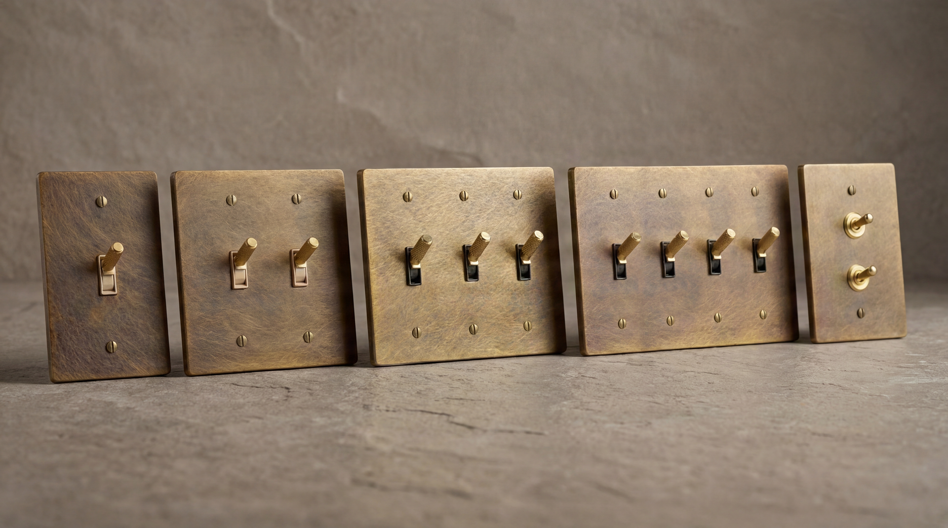 Aged Brass Toggle Switches arrayed, featuring solid brass, knurled textures, and a timeless, rich patina.