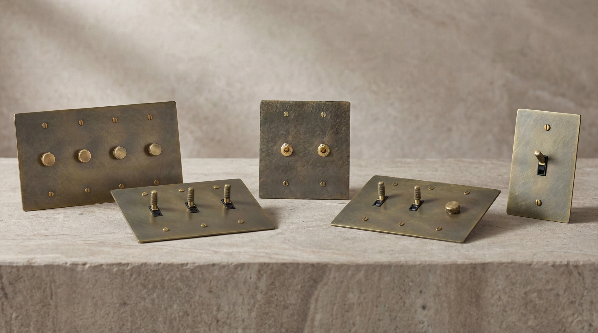 Patinated Antique Brass Light Switches and custom controls exude timeless craftsmanship on stone.