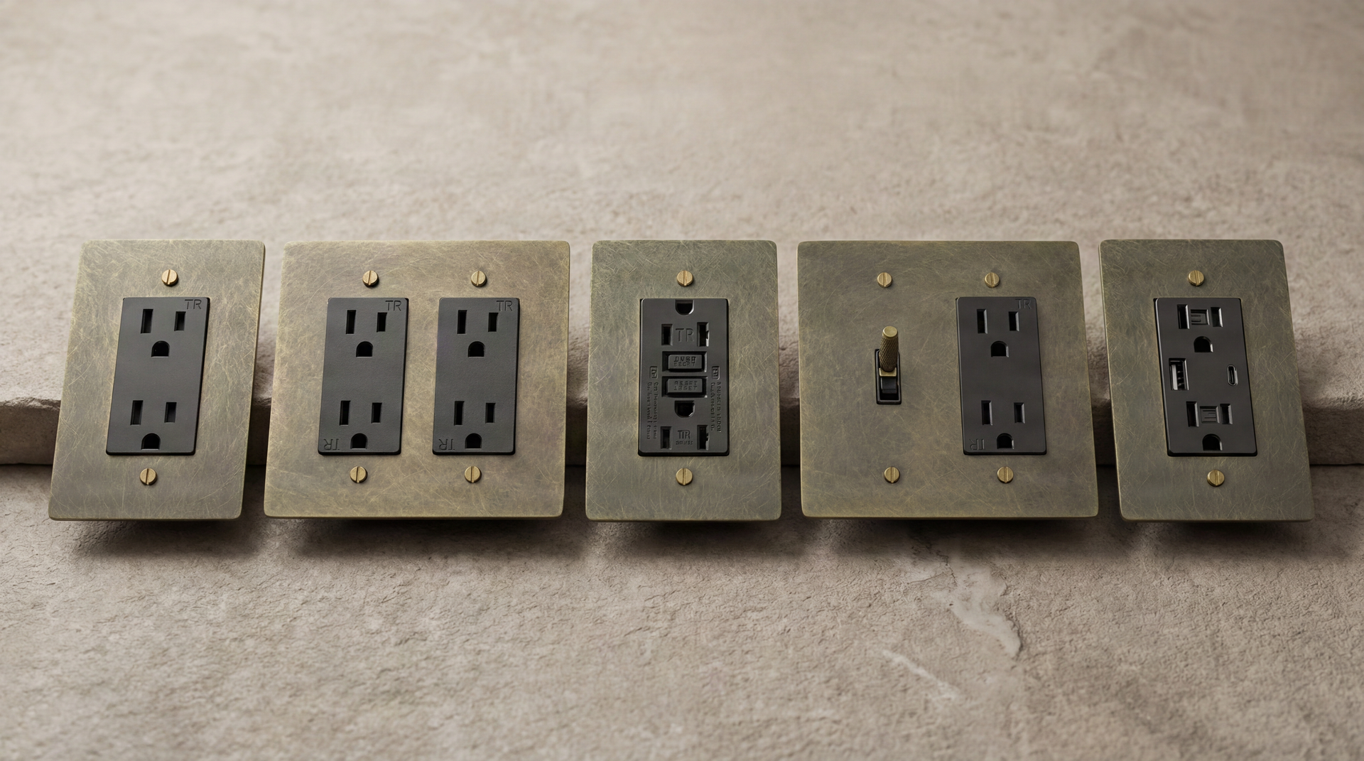Authentic patina on solid Antique Brass Outlets: duplex, GFCI, and a knurled toggle for heirloom quality.