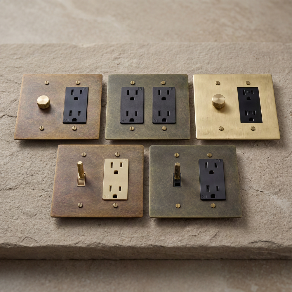 Artisan muted brass outlets, dimmers, and toggles.