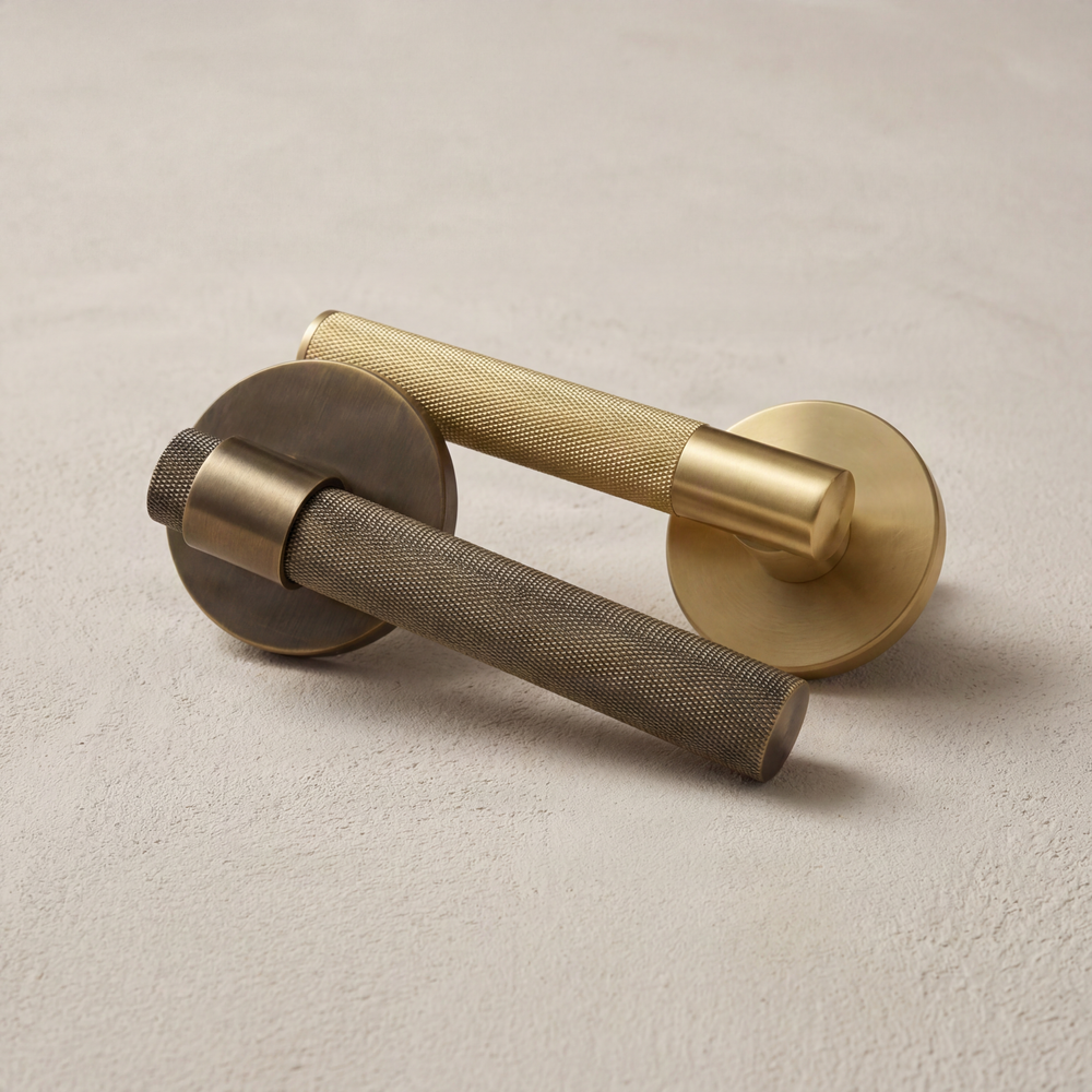 Tactile knurled brass door handles in two finishes.
