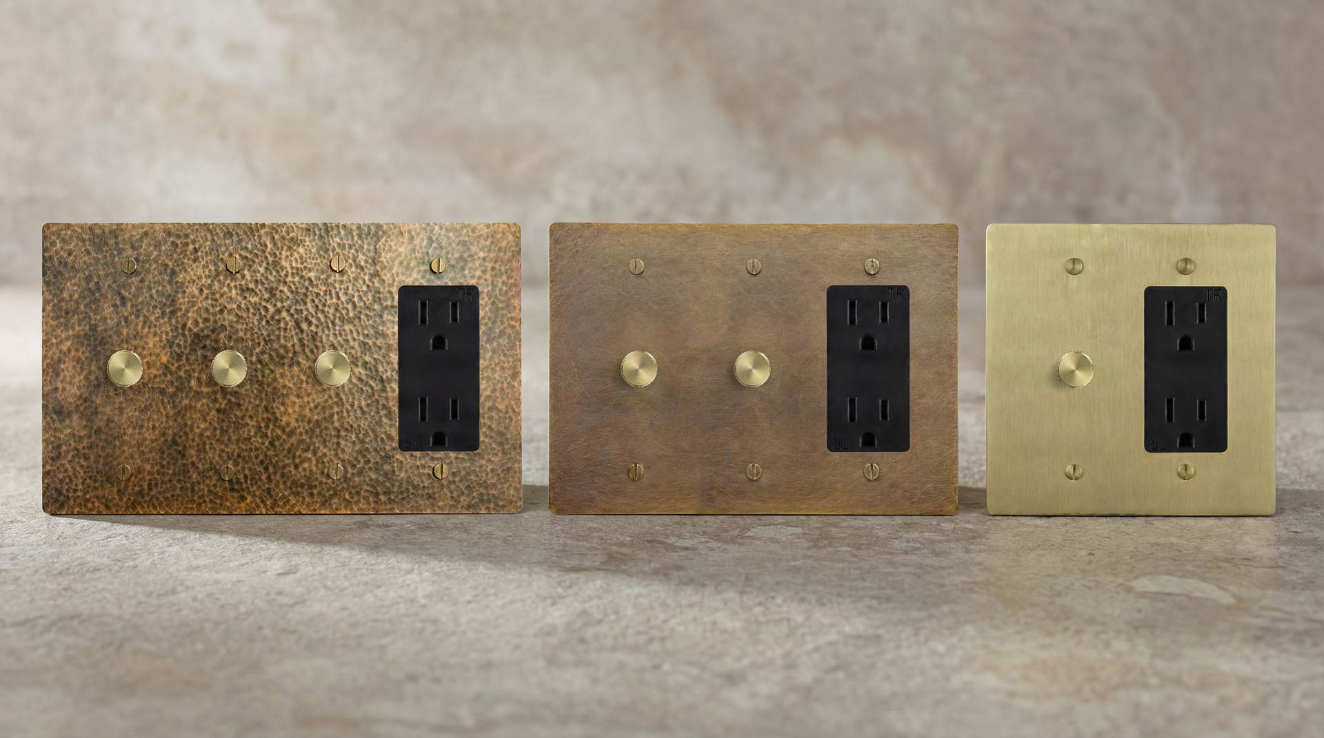 Five meticulously crafted Dimmer Outlets in aged brass, satin nickel, antique brass, satin brass, and matte black.