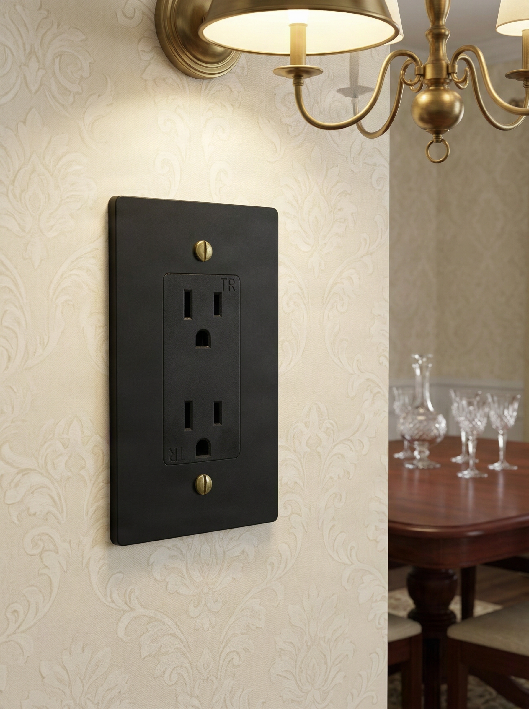 Elegant room features a matte black (antique brass accents) 1 gang decora switch plate on damask wallpaper.
