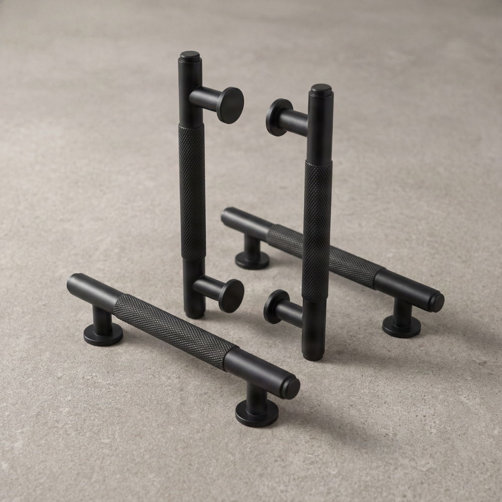 Four matte black knurled luxury door pulls.