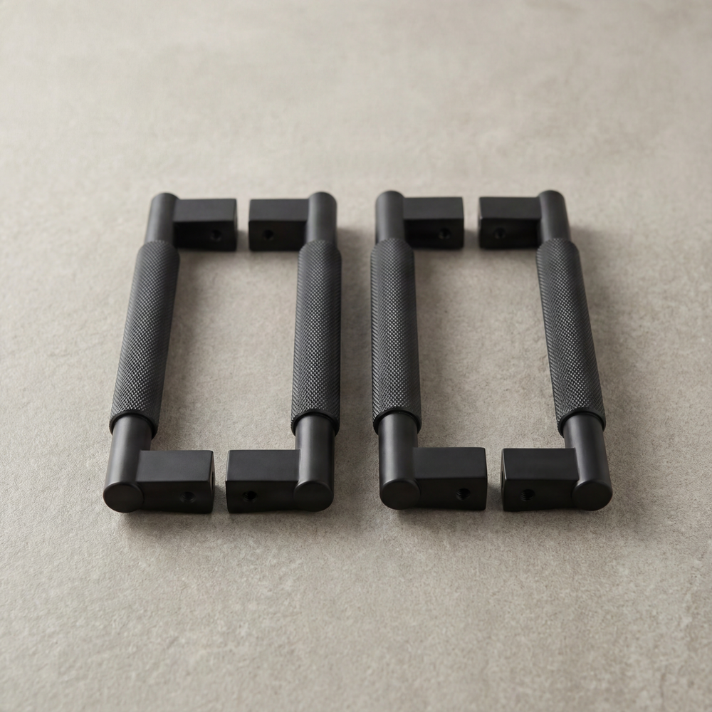 Tactile matte black knurled door pulls.