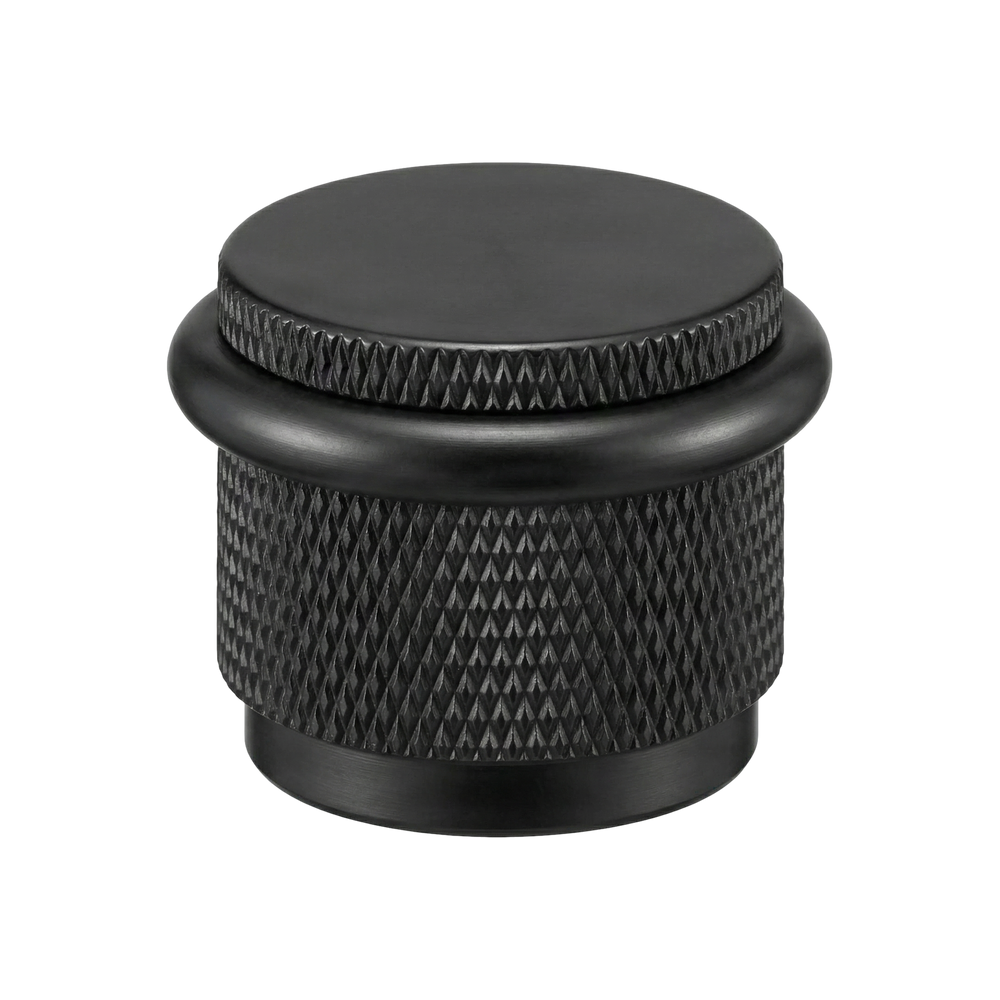matte black floor mount door stop: handcrafted solid brass with knurled texture.
