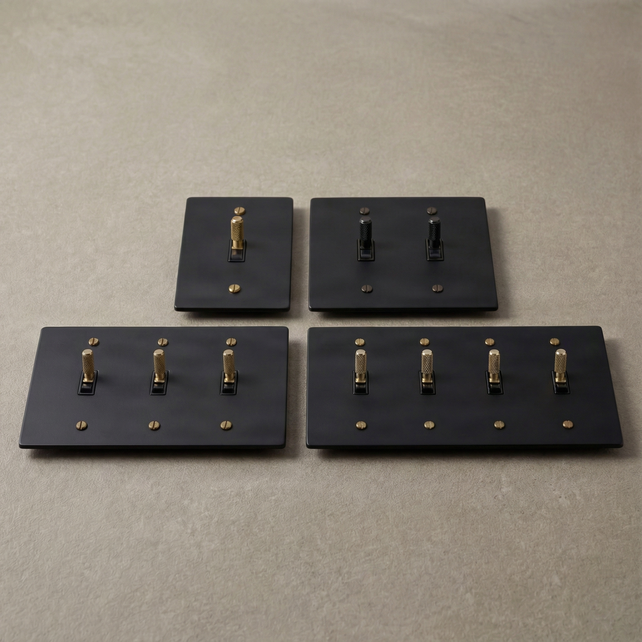 Heirloom matte black toggle switches, brass and black knurled.