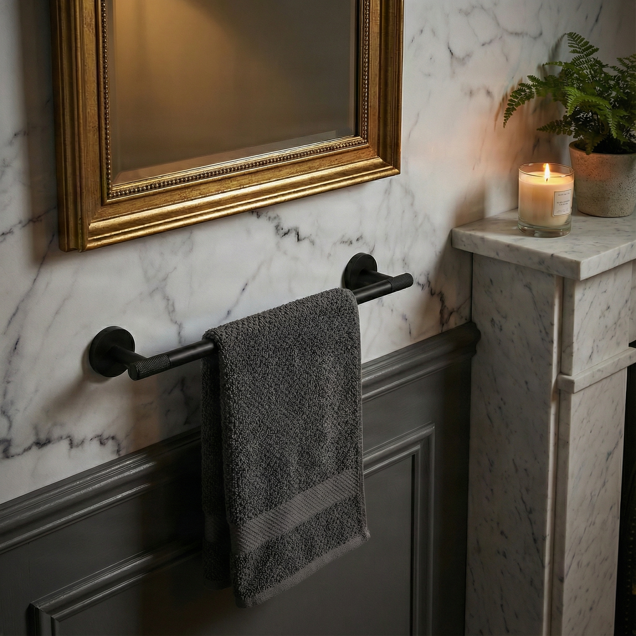 Elegant bathroom showcasing a modern brass bathroom hardware 24 inch towel bar with knurled texture on marble and wainscoting.