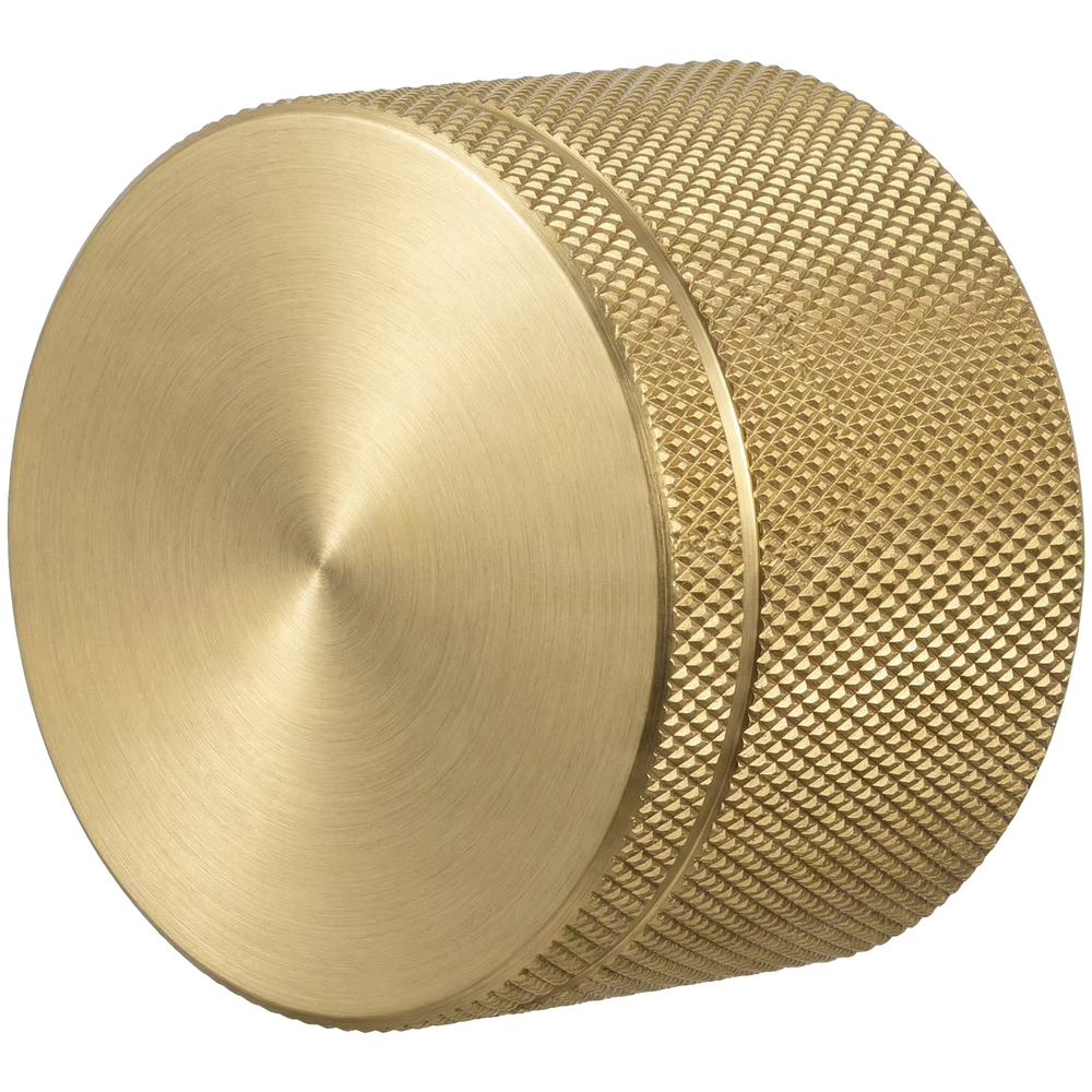 Solid satin brass door knob with elegant knurled texture and brushed face, reflecting timeless craftsmanship.