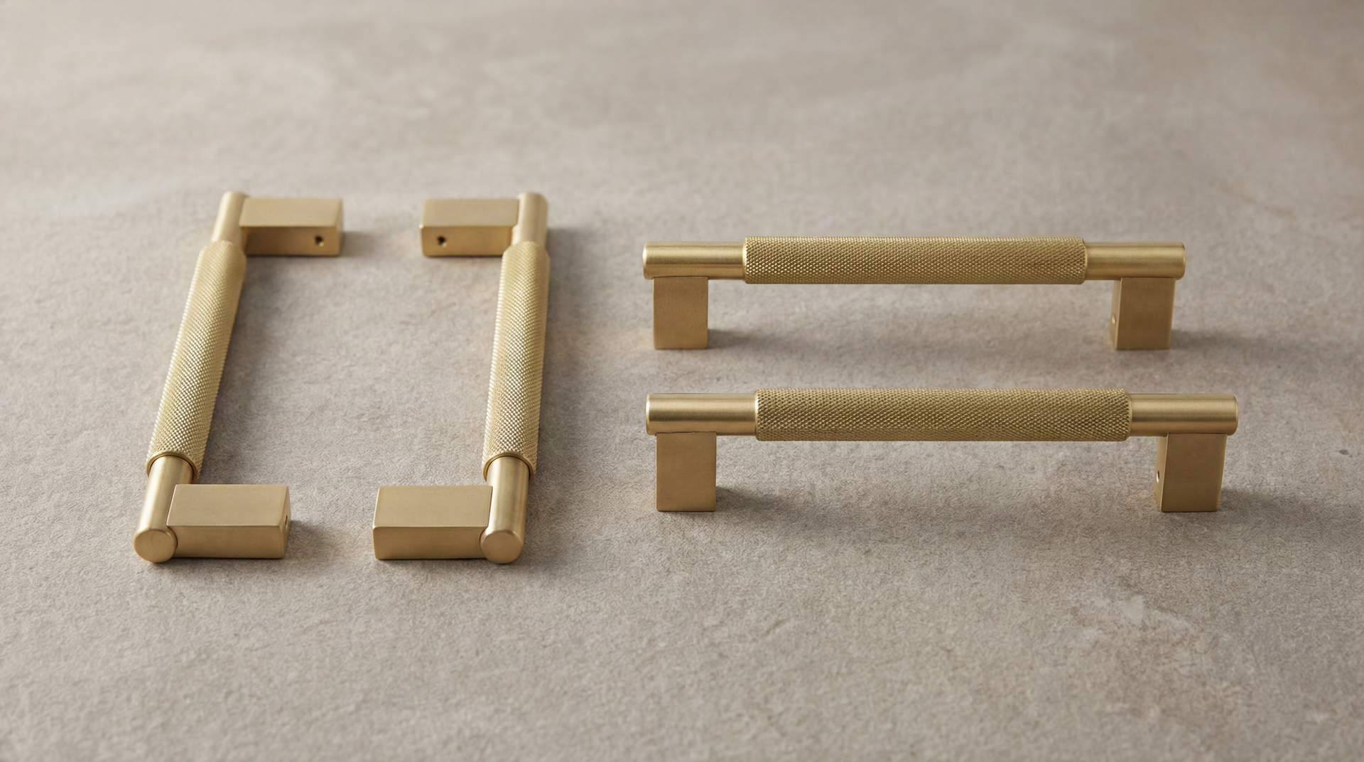 Satin Brass Door Pulls (Grassetto): two pairs of knurled brass hardware, one disassembled, one assembled, on a textured surface.