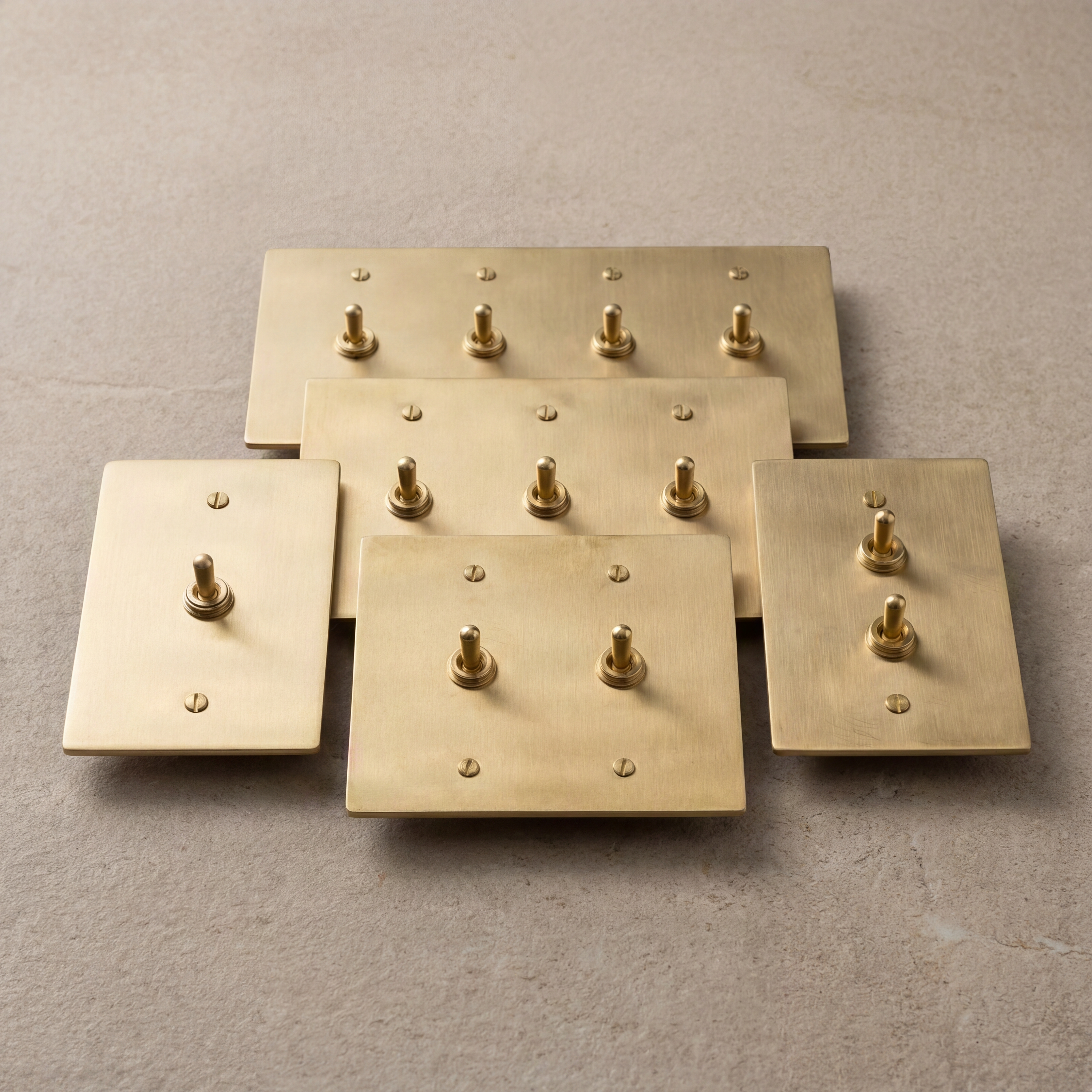 Collection of timeless satin brass vintage toggle switches.