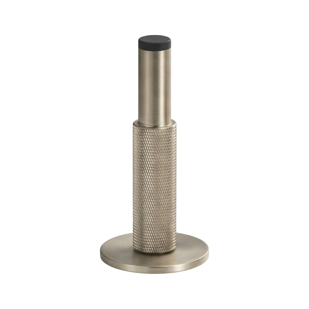 Refined satin nickel wall mount door stop with knurled texture, an heirloom of enduring craftsmanship.