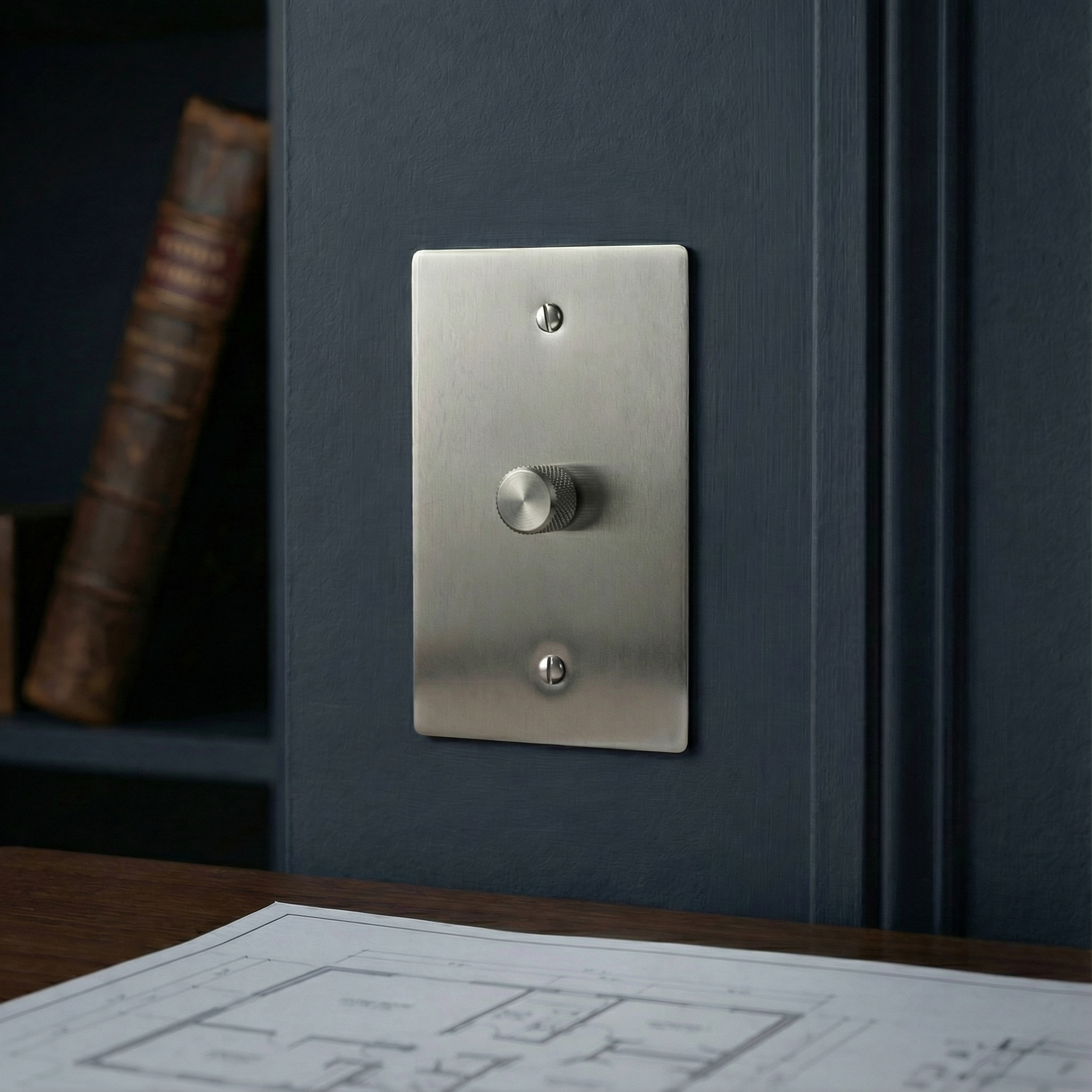 A satin nickel 1 gang dimmer switch plate with knurled knob graces a dark paneled wall in an elegant room.