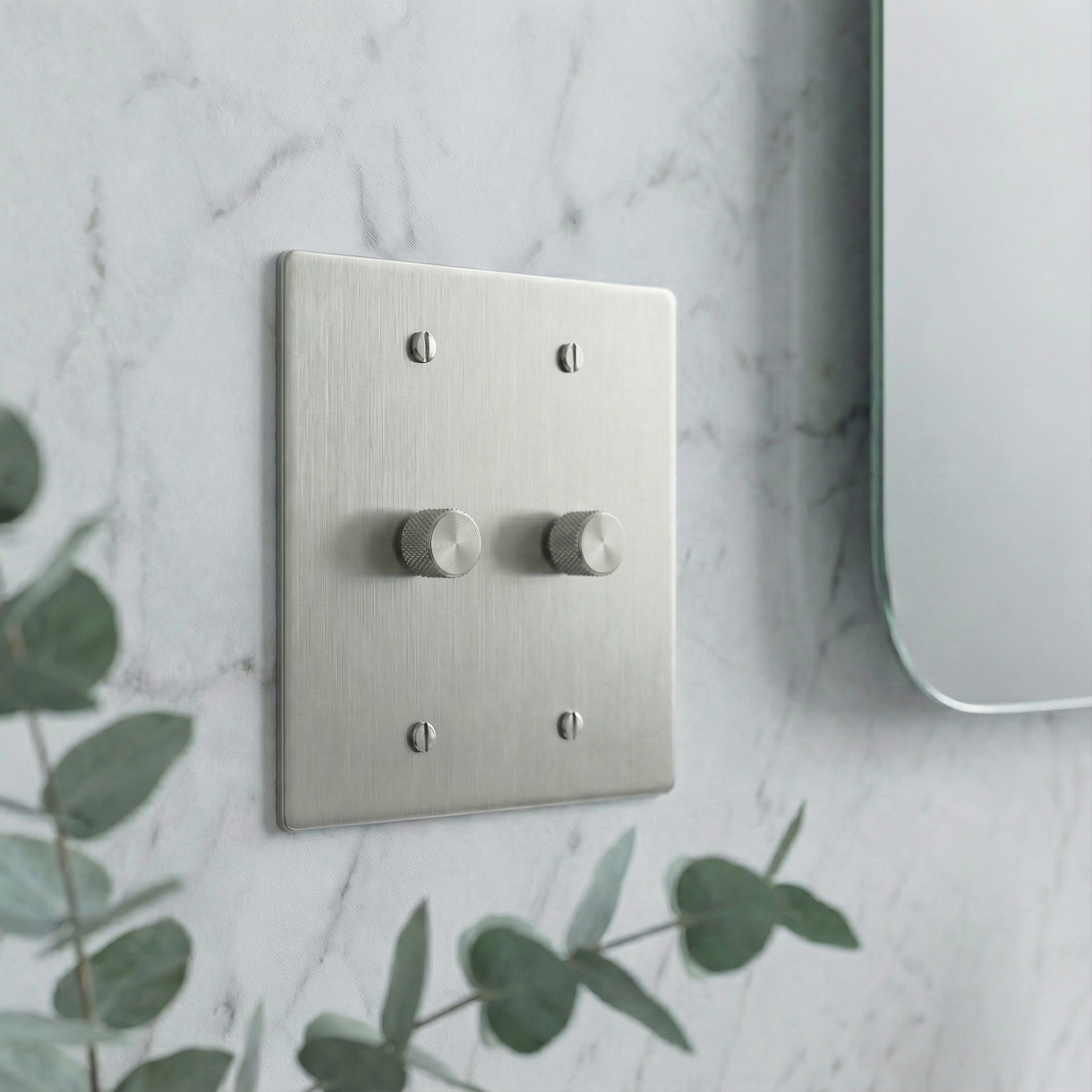 satin nickel 2 gang dimmer switch plate with knurled knobs on marble, evoking timeless luxury.