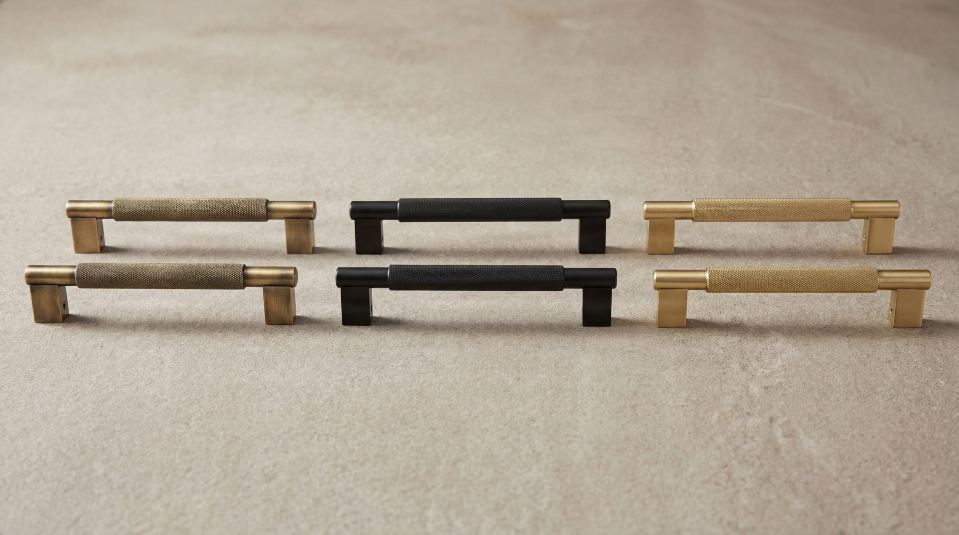 Short Door Pulls (Grassetto) in aged brass, matte black, satin brass; knurled texture, timeless design.